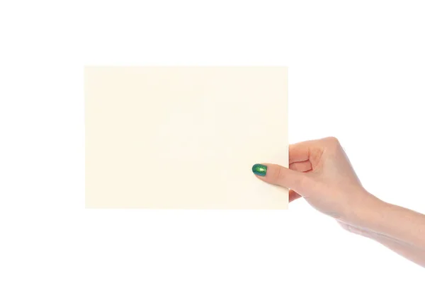 Frauenhand mit weißem Papierbanner auf weißem Grund — Stockfoto