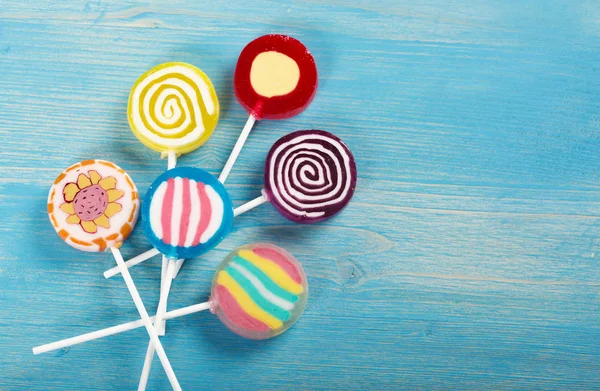 Lollipop on a wooden background — Stock Photo, Image