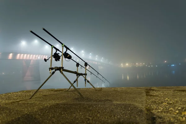 Carp rods in foggy night. Urban Edition. Night Fishing