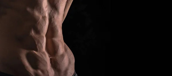 Close-up van perfect abs. Sexy gespierde mannelijk torso zes packs. — Stockfoto