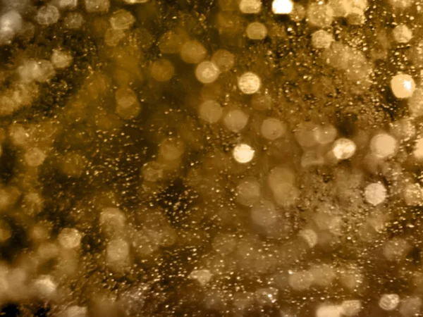 Abstract Gold Bokeh circles background. Gold blurred background,