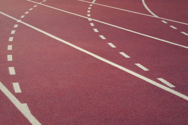 Running track on stadium. Red running track. Sport Background.