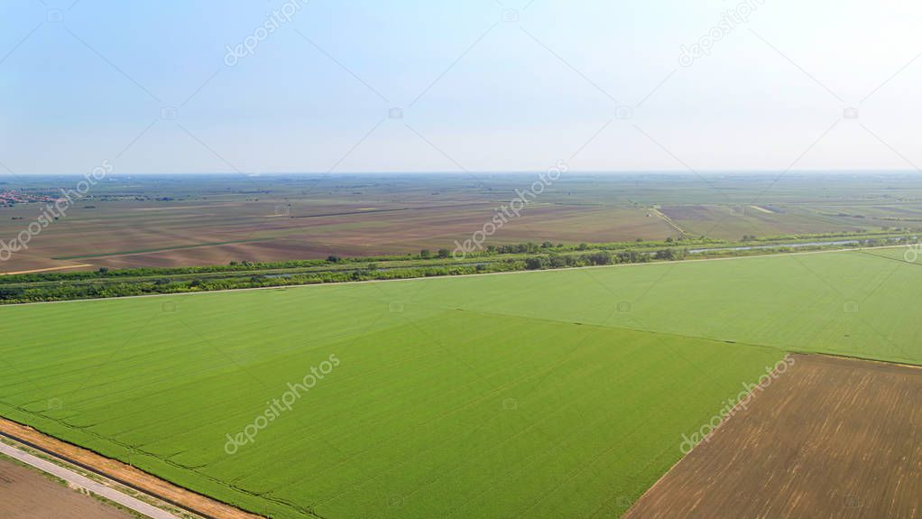 Aerial view over the agricultural fields spring time.