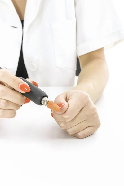Woman use Electric Nail File Drill in beauty salon — Stock Photo, Image