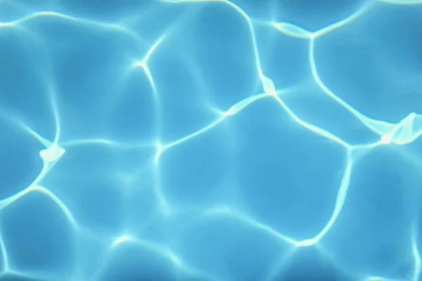 Schwimmbadwasser. Wellenwasser. Sonnenreflexion Hintergrund. — Stockfoto