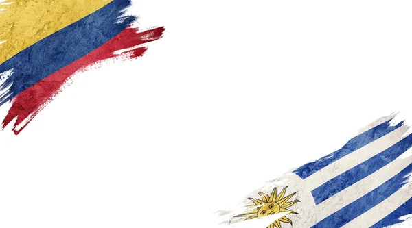 Bandeiras da Colômbia e Uruguai sobre fundo branco — Fotografia de Stock