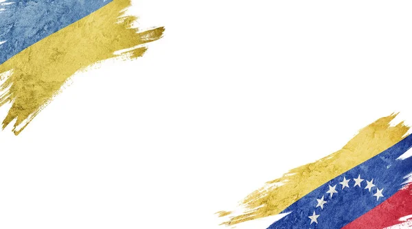 Beyaz arka planda Ukrayna ve Venezuela bayrakları — Stok fotoğraf