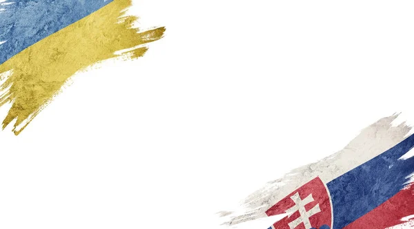 Прапори України та Словаччини на білому тлі — стокове фото