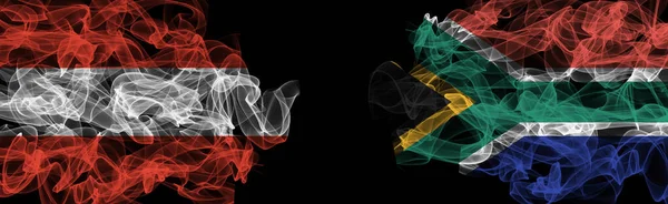 Flags of Austria and South Africa on Black background, Austria vs South Africa Smoke Flag