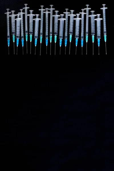 Medical Syringes with Needle on Black Background, Close up Syringe, Health care concept.