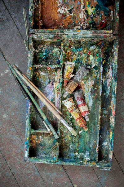paint brushes in dirty box