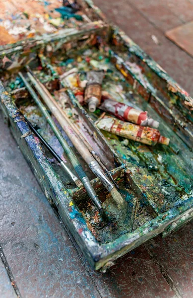 paint brushes in dirty box