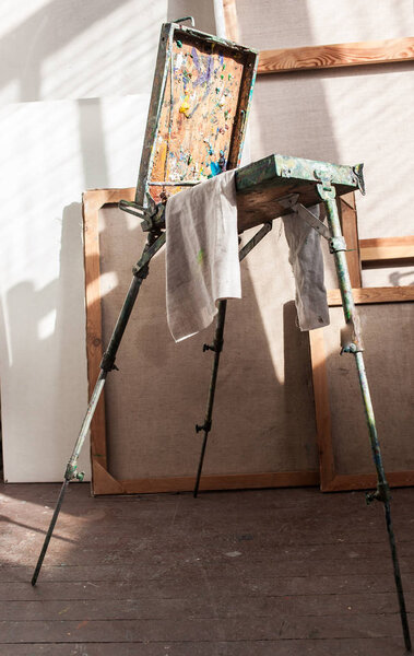 box with paints in artistic studio