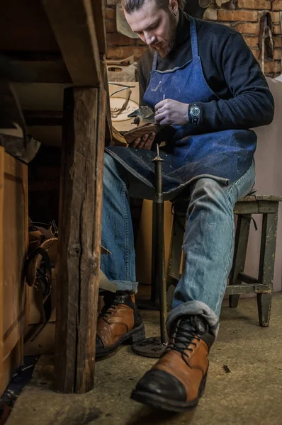 Male shoe maker working