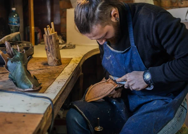 Male shoe maker working