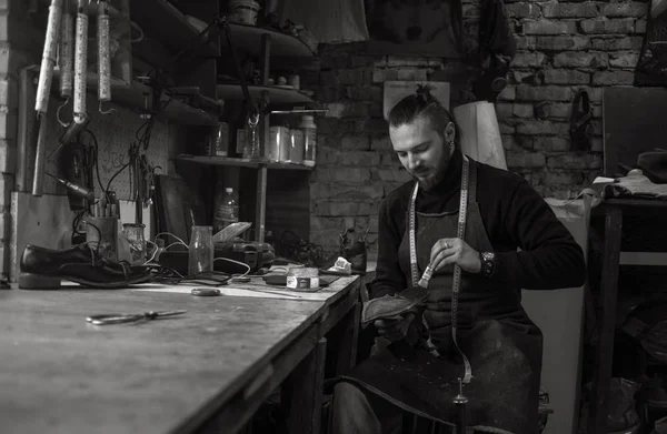 Male shoe maker working