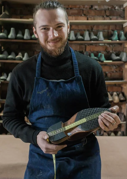 Male shoe maker working