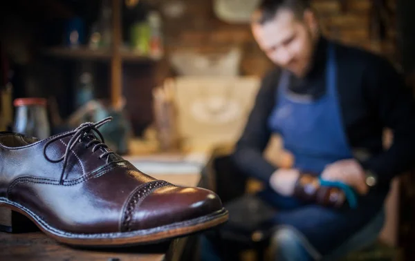 Male shoe maker working