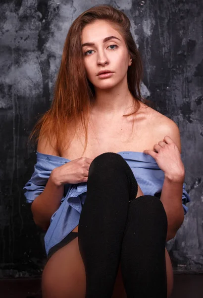 Young sexy girl in a man 's shirt — стоковое фото