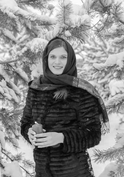 Girl in a scarf and coat with candle black and white — Stock Photo, Image