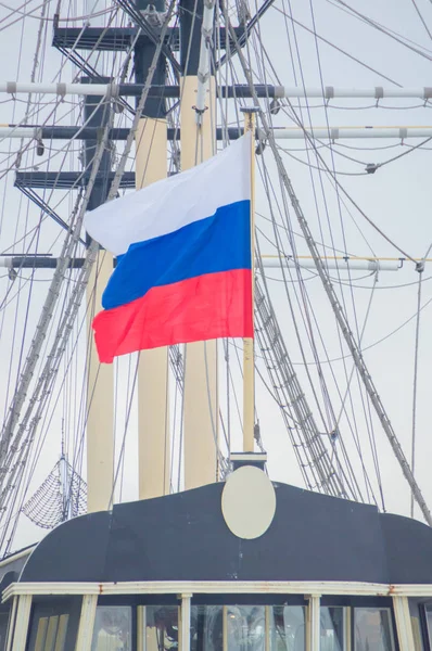 the flag of Russia on an old sailing ship