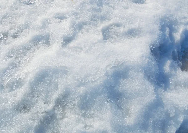 Texturen av trampade snön bakgrund — Stockfoto