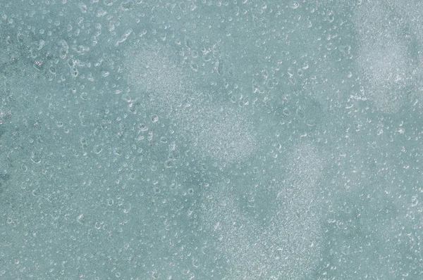 Konsistens av isen med luftbubblor, bakgrund. — Stockfoto