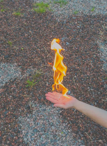 focus on the hand the fire burns.