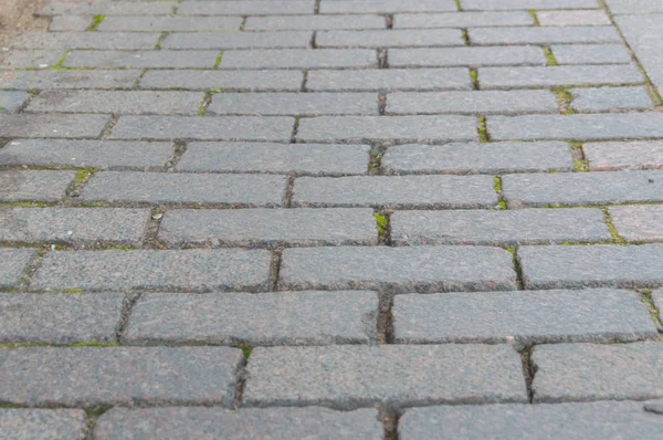 Abstrakter Hintergrund des alten Kopfsteinpflasters in Nahaufnahme — Stockfoto