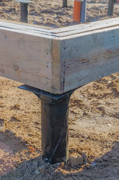 Closeup of hewn planks, the timber framing of a house under cons — Stock Photo, Image