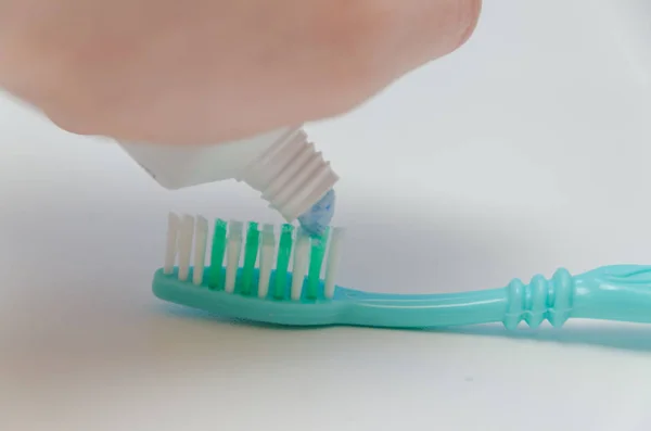 On the toothbrush smear toothpaste — Stock Photo, Image