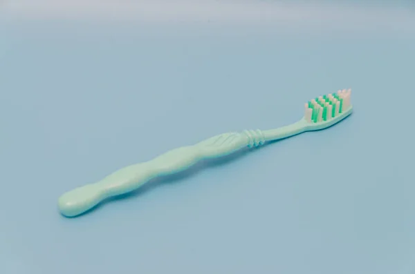 Background, toothbrush on blue table — Stock Photo, Image