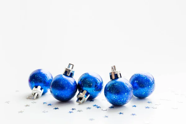 Christmas and New Year background with blue starry decorative balls for Christmas tree. Place for text. — Stock Photo, Image
