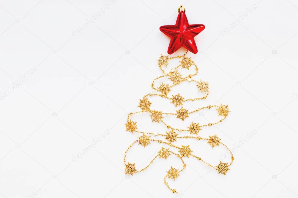 Christmas Tree made of golden snowflake garland with red bright star. New Year symbol with place for text. Flat lay, top view.