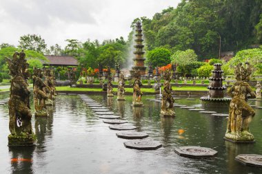 Water Palace of Tirta Gangga. Landmark in Bali, Karangasem, Indonesia. Winter rainy season. clipart
