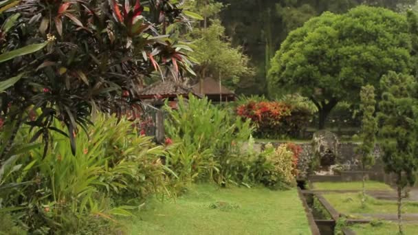 Water Palace of Tirta Gangga. Landmark in Bali Karangasem Indonesia. Winter rainy season. — Stock Video