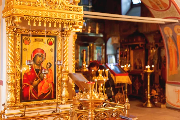 Golden candleholder and icons, traditional interior of Orthodox church. Russia. — Stock Photo, Image