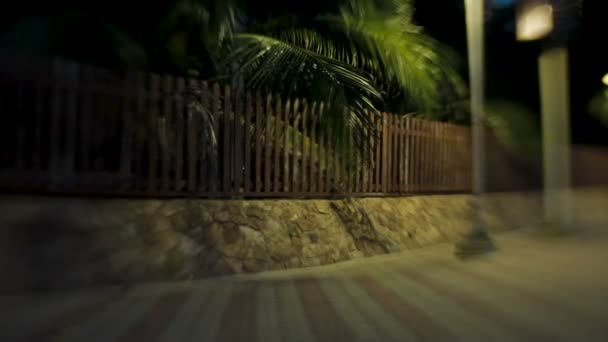 Alley along the sea, lit by lanterns. Shooted with Lens Baby Sweet 35mm — Stock Video