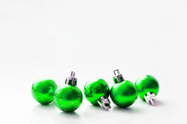 Christmas and New Year background with green decorative balls for Christmas tree. Place for text. — Stock Photo, Image