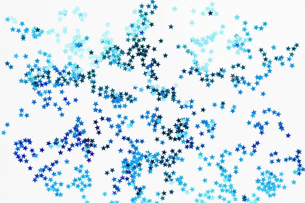 Tatil arka plan mavi yıldız konfeti ile. Noel ve yeni yıl kartları için iyi bir arka plan. — Stok fotoğraf