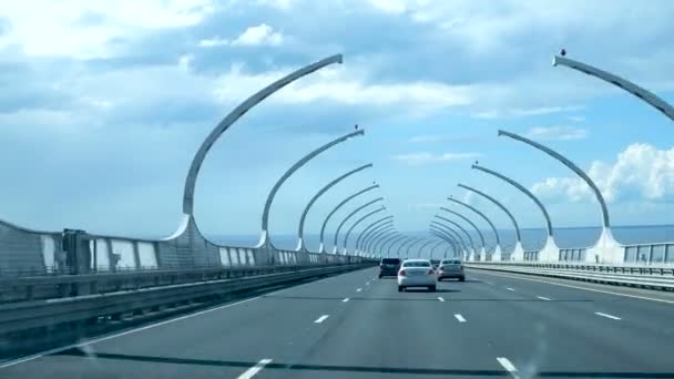 SAINT-PETERSBURG, RUSSIA - July 05, 2017. Cars moving on toll section of The Saint Petersburg Ring Road, A 118 Western high-speed diameter over the Gulf of Finland — Stock Video