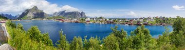 Beautiful scandinavian landscape with mountains and fjords. Panorama view of Reine village on Lofoten islands, Norway. clipart