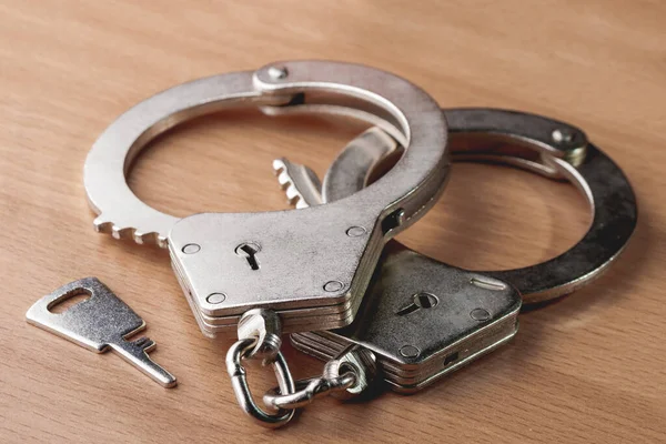 Locked Handcuffs Wooden Background Legal Responsibility Violating Crime — Stock Photo, Image