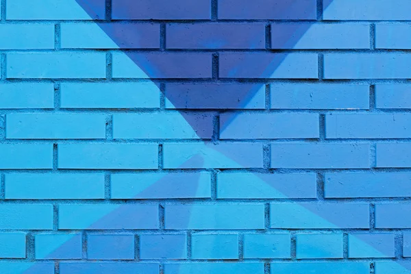 Colorful (blue) painted brick wall as background, texture