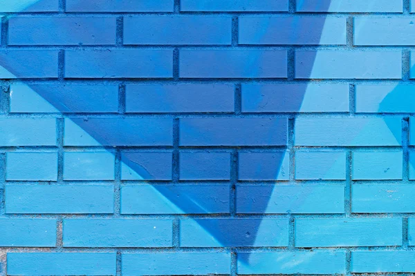 Färgglada (blå) målade tegelvägg som bakgrund, textur — Stockfoto