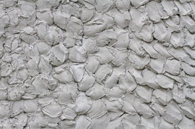 Arka plan olarak duvarda gri dekoratif alçı, doku