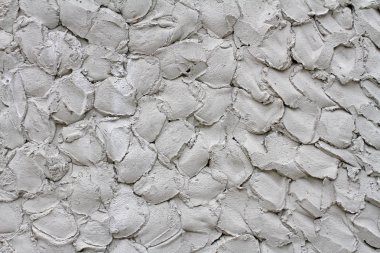 Arka plan olarak duvarda gri dekoratif alçı, doku