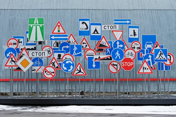 Chaotic Set Road Signs Gray Wall Background Translated Russian Stop Stock Image