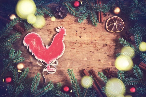 Vintage Christmas background. Fire Rooster symbol of the year. S