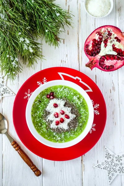Christmas food healthy idea. Green smoothies decorated with Christmas tree